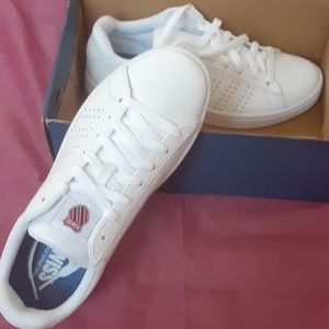 All white swiss tennis shoes
